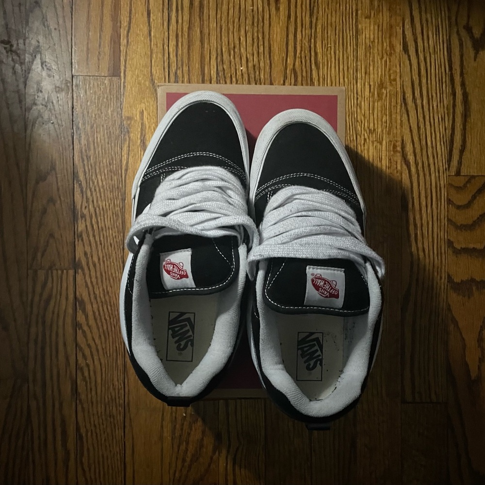 Black and white Vans Old Skool trainers